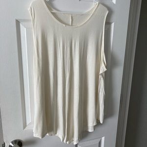 Sleeveless tunic with handkerchief cut hem- priced for all 3!